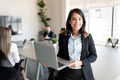 Professional Woman Entrepreneur holding her computer